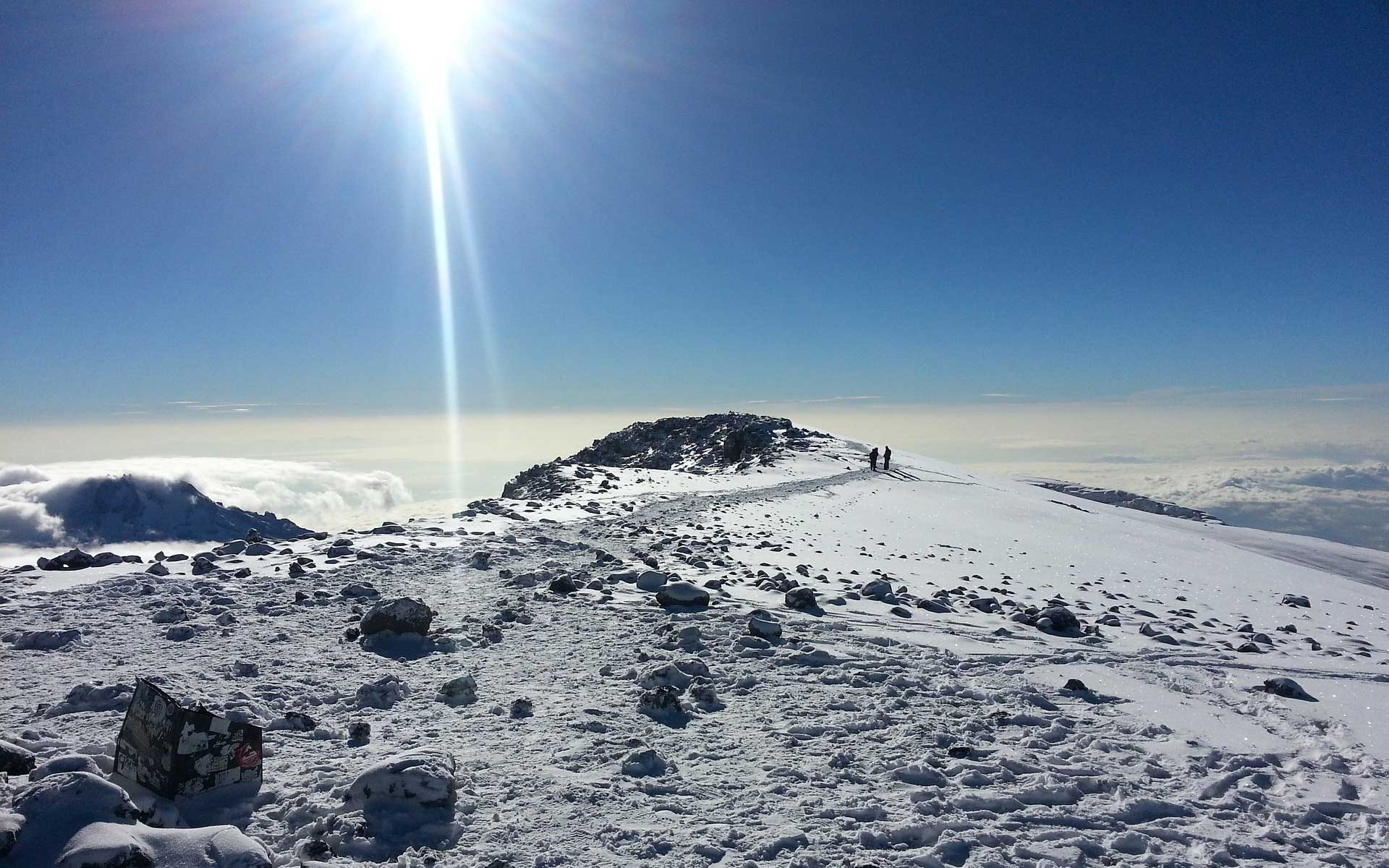 Blue skies and snow at the peak of africas tallest mountain kilimanjaro tanzania